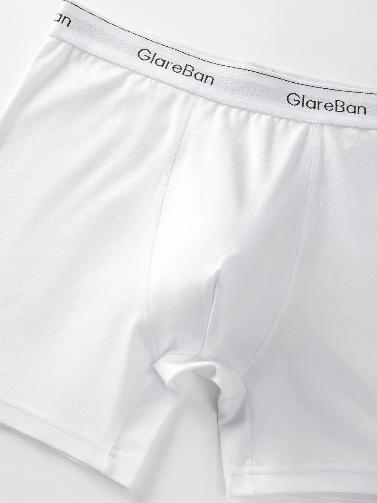 Close-up of soft white boxer brief fabric and waistband
